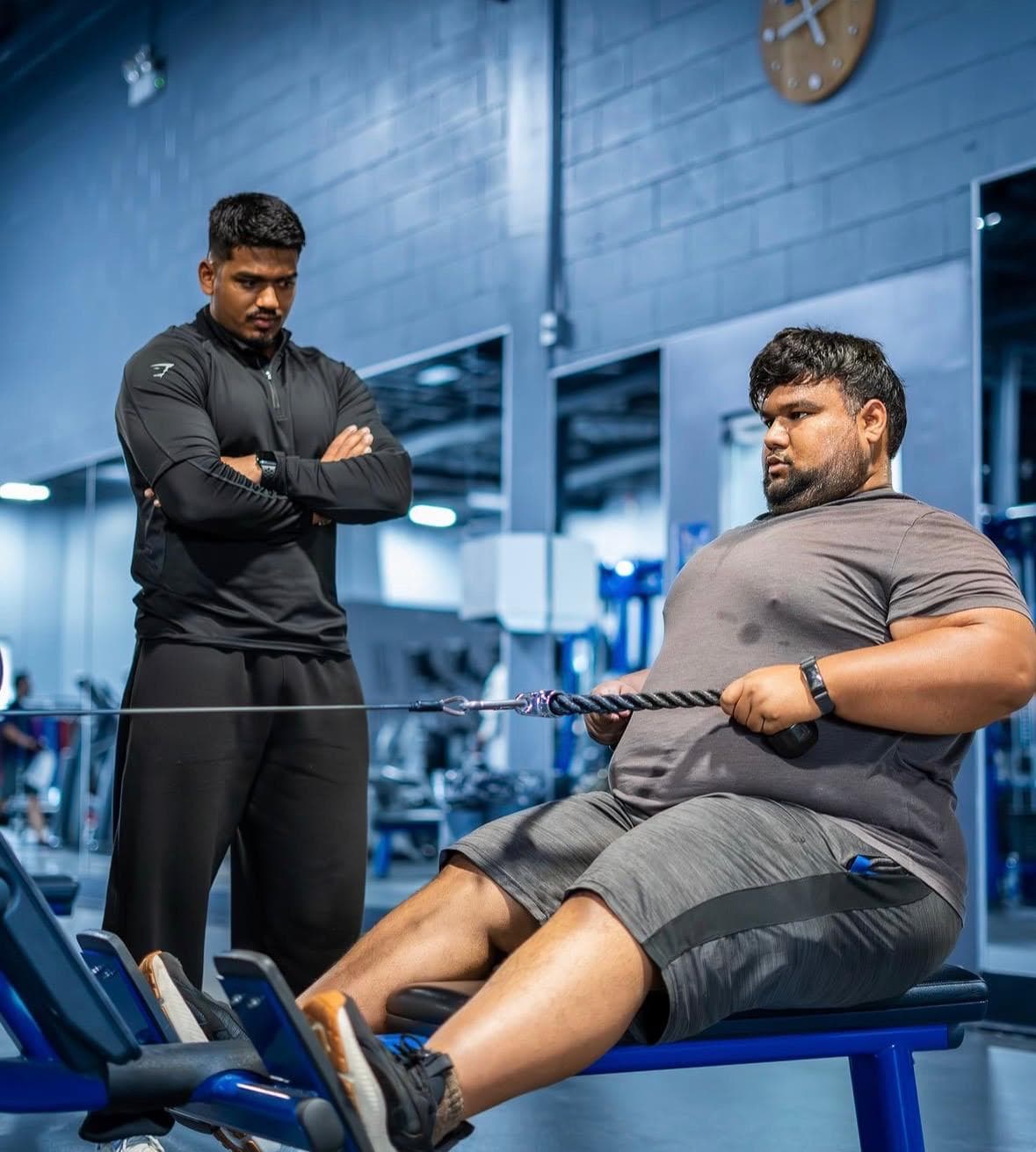 KT coaching a client at the gym